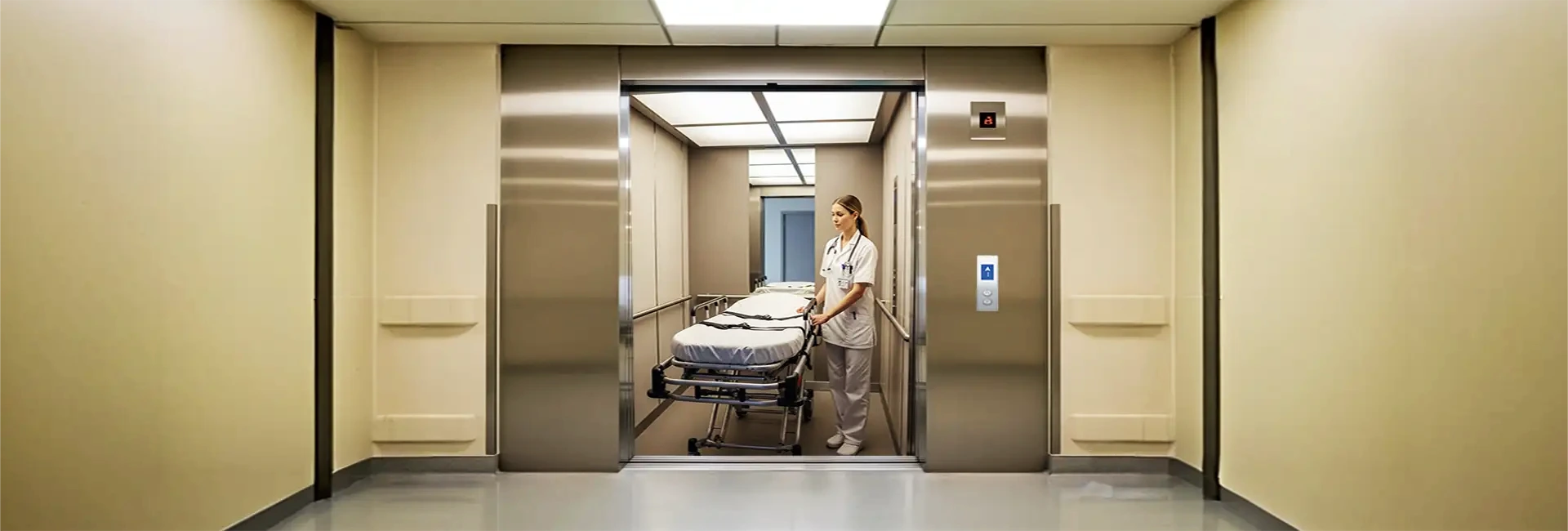 A nurse is coming out with a patient bed from a lift